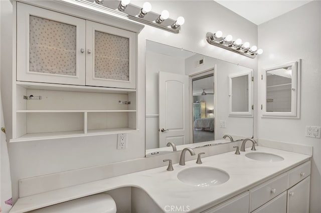 bathroom featuring double vanity