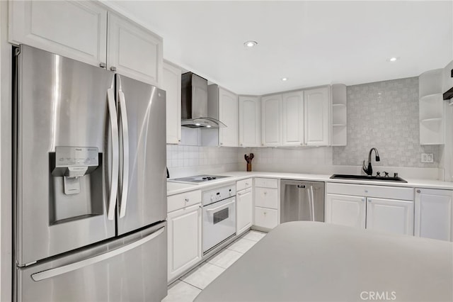 10145 Larwin Ave Unit 2, Chatsworth, CA 91311 - kitchen with appliances with stainless steel finishes, a sink, wall chimney exhaust hood, open shelves, and light tile patterned floors