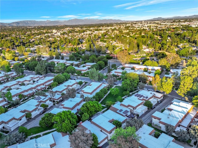 aerial view of residential area featuring a mountainous background