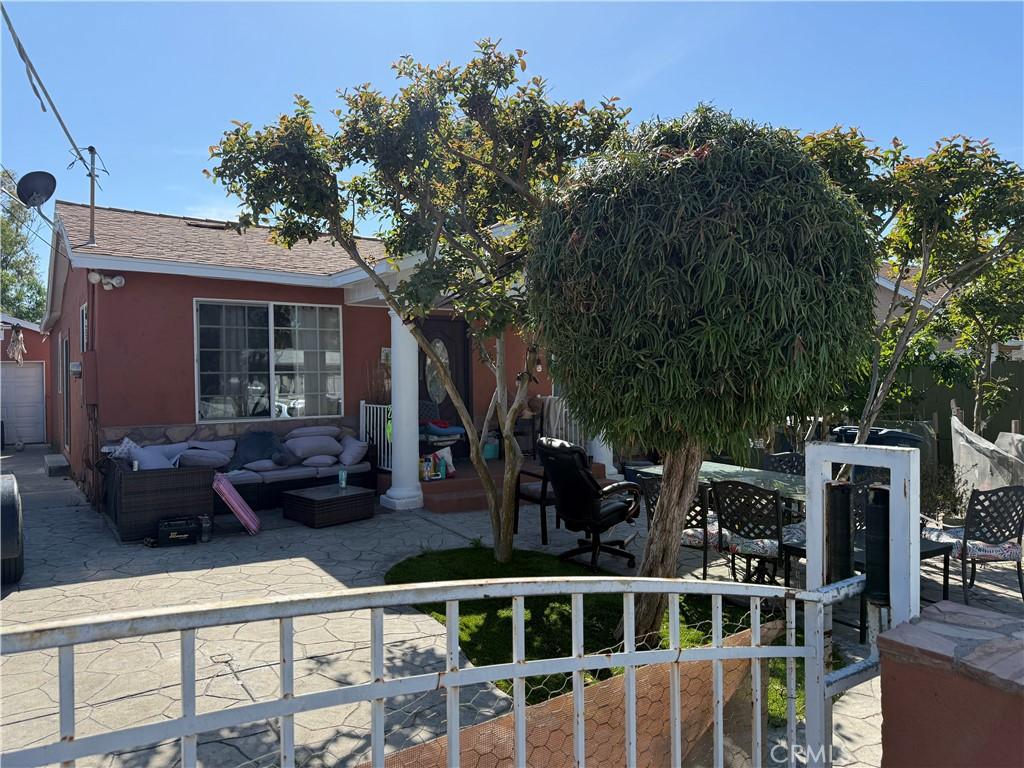 1151 S Maple St, Escondido, CA 92025 - view of front of property with a patio area, an outdoor hangout area, fence, and a shingled roof