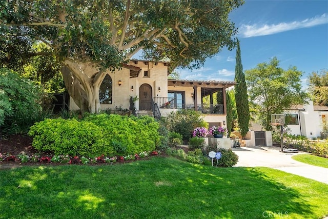 3904 Via Cardelina, Palos Verdes Estates, CA 90274 - mediterranean / spanish house featuring a balcony, stucco siding, a front yard, and driveway