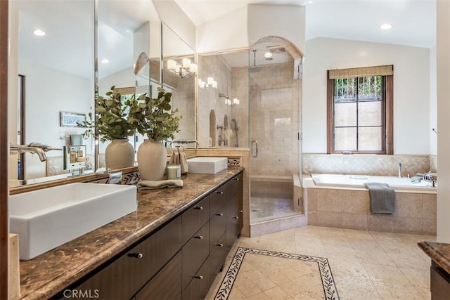 3904 Via Cardelina, Palos Verdes Estates, CA 90274 - bathroom featuring vaulted ceiling, double vanity, a shower stall, a garden tub, and recessed lighting