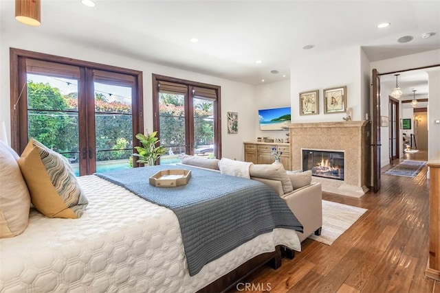 3904 Via Cardelina, Palos Verdes Estates, CA 90274 - bedroom featuring french doors, access to exterior, hardwood / wood-style flooring, a fireplace, and recessed lighting