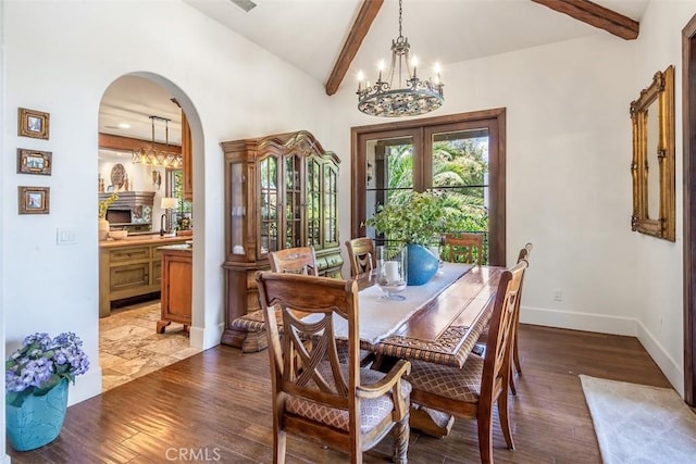 3904 Via Cardelina, Palos Verdes Estates, CA 90274 - dining area with a chandelier, arched walkways, baseboards, and dark wood-style floors