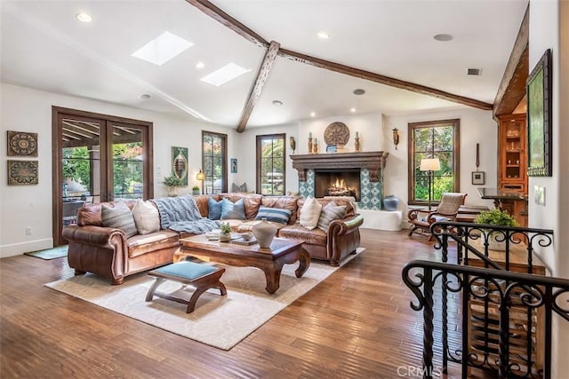 3904 Via Cardelina, Palos Verdes Estates, CA 90274 - living area featuring a skylight, wood finished floors, a lit fireplace, baseboards, and recessed lighting