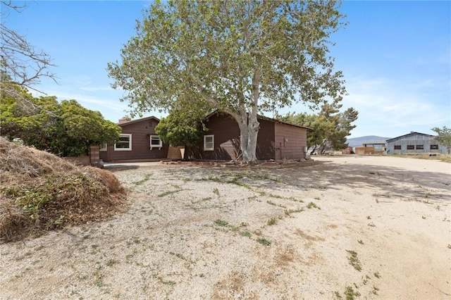 18333 Lancaster Rd, Lancaster, CA 93536 - view of front facade with a chimney