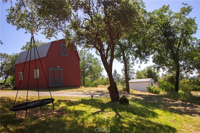 32760 Ram Ln, North Fork, CA 93643 - view of grassy yard with a barn and an outbuilding