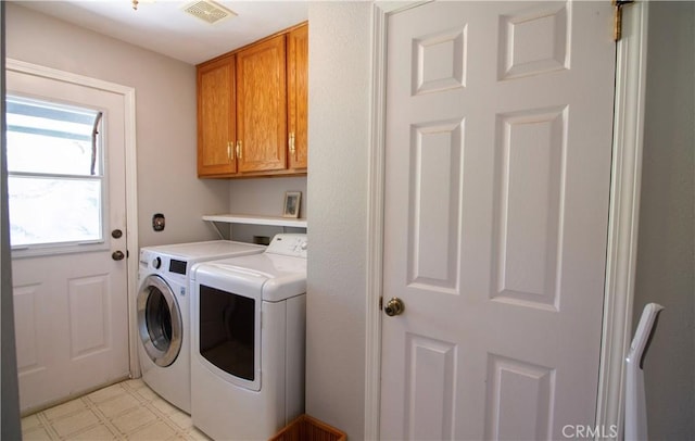 32760 Ram Ln, North Fork, CA 93643 - washroom featuring washer and dryer, cabinet space, and light flooring