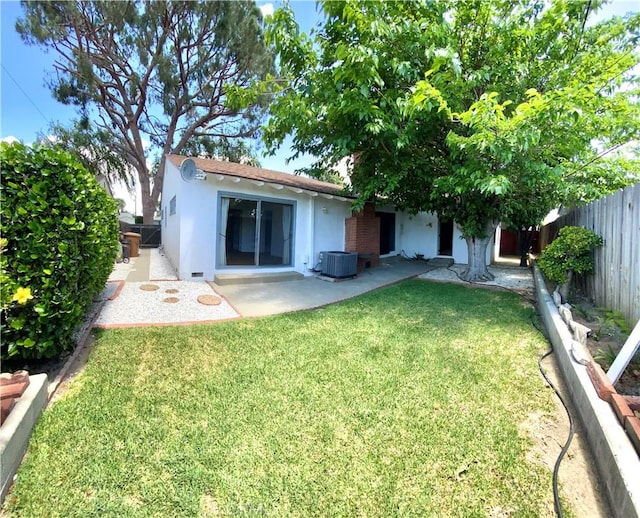 back of house featuring stucco siding, a patio area, and cooling unit
