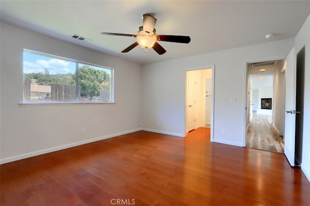 43038 Glacier Ln, Coarsegold, CA 93614 - unfurnished bedroom with wood finished floors, baseboards, and ceiling fan