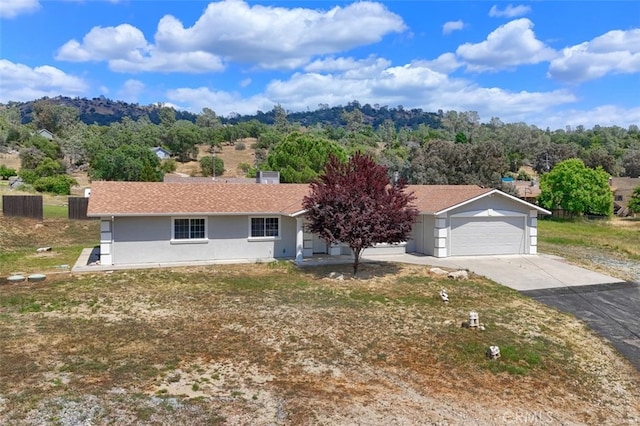 43038 Glacier Ln, Coarsegold, CA 93614 - view of front of property featuring stucco siding and driveway