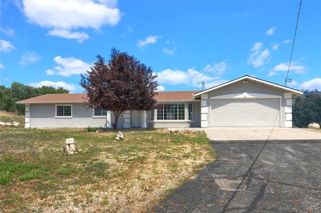 43038 Glacier Ln, Coarsegold, CA 93614 - ranch-style house with driveway, a garage, a front yard, and stucco siding