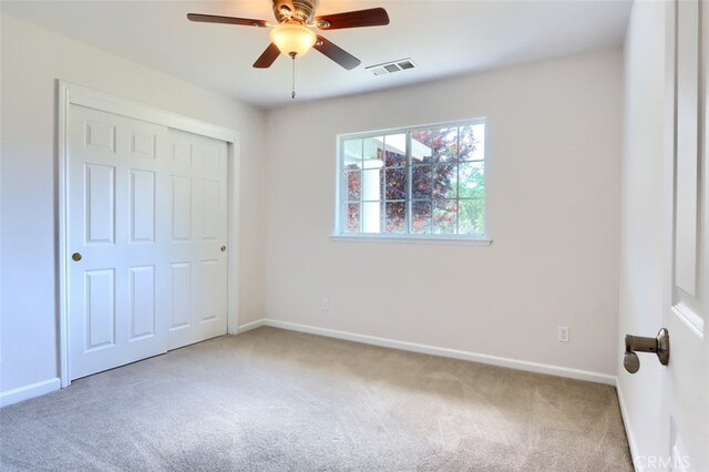 43038 Glacier Ln, Coarsegold, CA 93614 - unfurnished bedroom with carpet, baseboards, a closet, and a ceiling fan