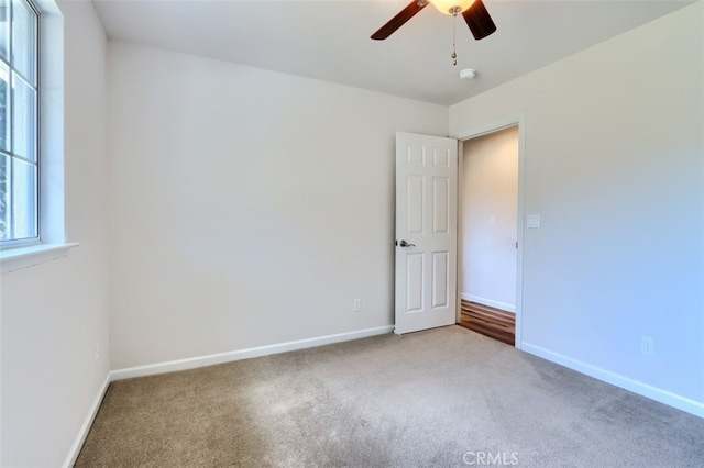 43038 Glacier Ln, Coarsegold, CA 93614 - carpeted spare room with a ceiling fan and baseboards