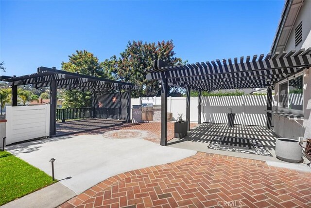 25232 Grissom Rd, Laguna Hills, CA 92653 - gate with a pergola and a patio area
