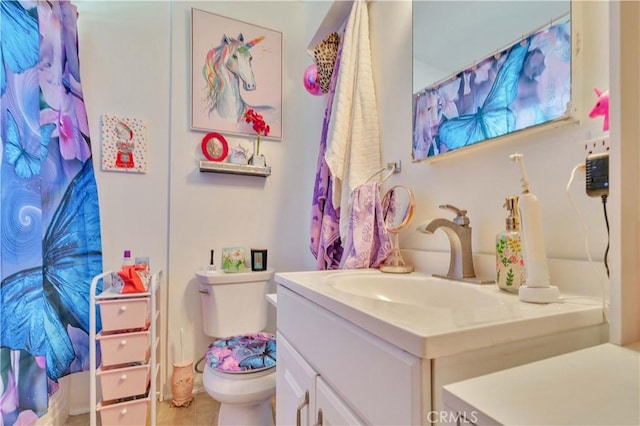 bathroom featuring vanity and toilet