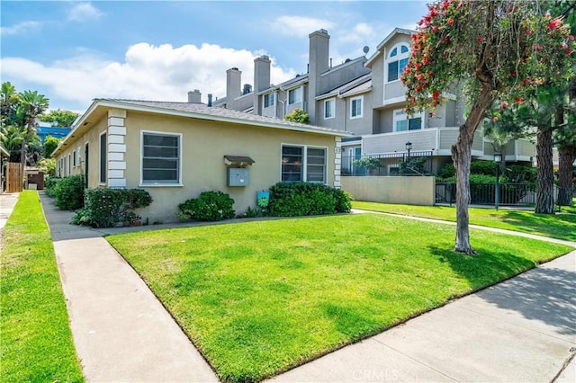 view of front of property featuring stucco siding and a chimney