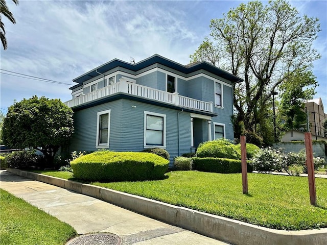 4308 Lime St, Riverside, CA 92501 - view of property exterior with a balcony and a lawn