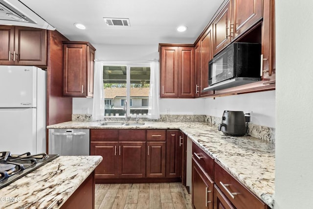 126 E Ventura St Unit F, Santa Paula, CA 93060 - kitchen with freestanding refrigerator, black microwave, stainless steel dishwasher, cooktop, and recessed lighting