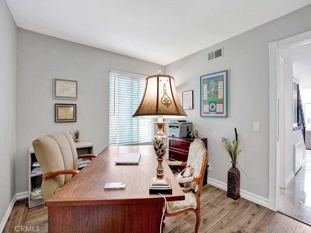 3842 Montego Dr, Huntington Beach, CA 92649 - office area featuring wood finished floors and baseboards
