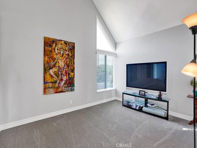 3842 Montego Dr, Huntington Beach, CA 92649 - carpeted living area with lofted ceiling and baseboards