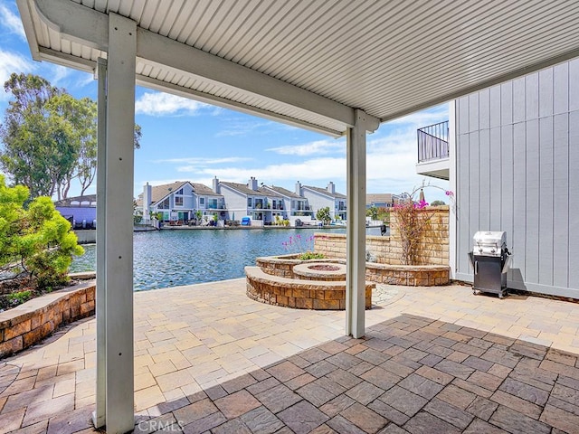 3842 Montego Dr, Huntington Beach, CA 92649 - view of patio with a water view, grilling area, a residential view, and an outdoor fire pit