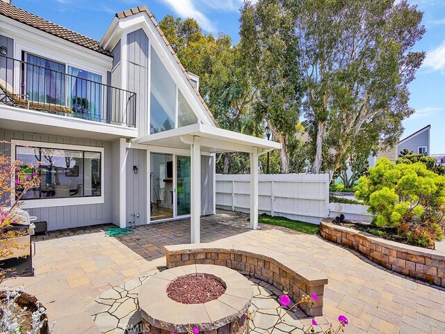 3842 Montego Dr, Huntington Beach, CA 92649 - view of patio with a balcony and fence
