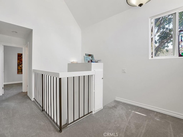 3842 Montego Dr, Huntington Beach, CA 92649 - hallway featuring carpet floors, lofted ceiling, and baseboards