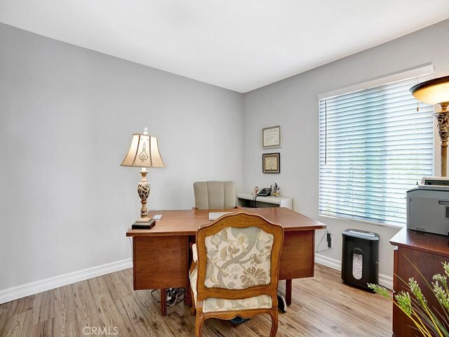 3842 Montego Dr, Huntington Beach, CA 92649 - home office featuring light wood-style flooring and baseboards