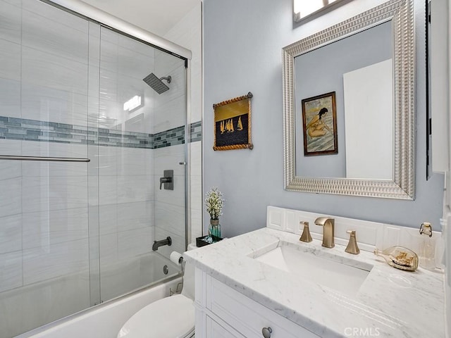 3842 Montego Dr, Huntington Beach, CA 92649 - bathroom with combined bath / shower with glass door, vanity, and toilet