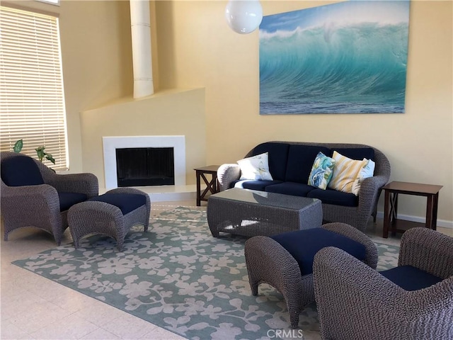 3842 Montego Dr, Huntington Beach, CA 92649 - living area featuring a fireplace with raised hearth and healthy amount of natural light