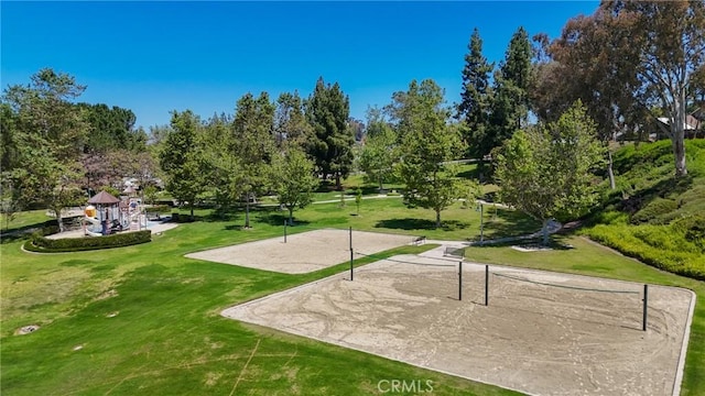 24182 Torena Cir, Mission Viejo, CA 92691 - view of community featuring volleyball court, a yard, and view of scattered trees