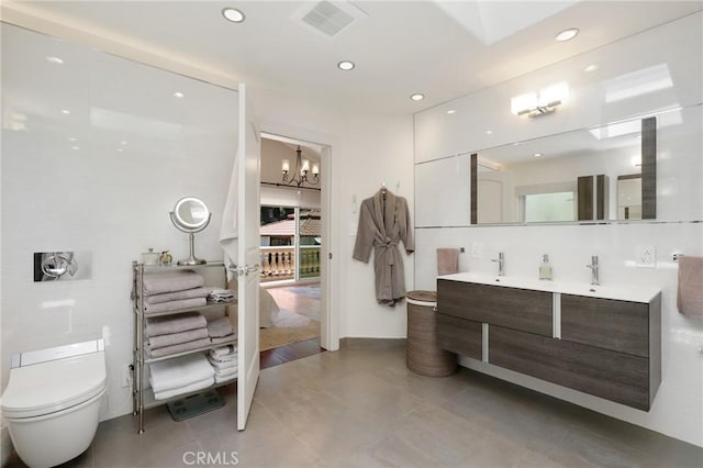 24182 Torena Cir, Mission Viejo, CA 92691 - bathroom with a chandelier, toilet, double vanity, recessed lighting, and tile patterned floors