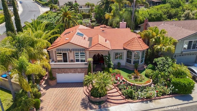 24182 Torena Cir, Mission Viejo, CA 92691 - view of front of house with a tile roof, a garage, decorative driveway, and stucco siding