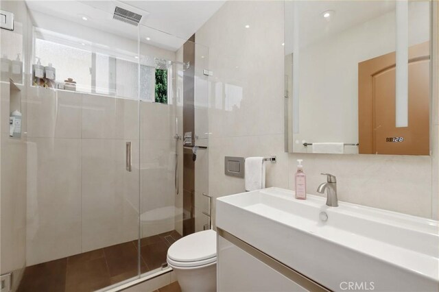 24182 Torena Cir, Mission Viejo, CA 92691 - bathroom featuring toilet, a shower stall, vanity, and recessed lighting