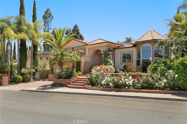 24182 Torena Cir, Mission Viejo, CA 92691 - mediterranean / spanish-style house with a tile roof and stucco siding