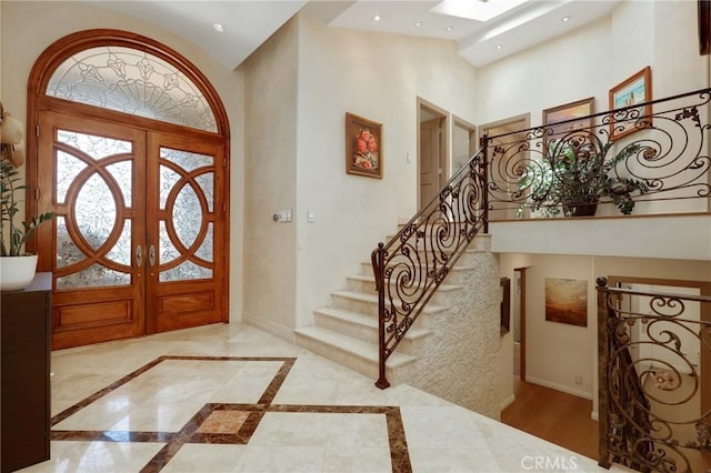 24182 Torena Cir, Mission Viejo, CA 92691 - entryway featuring baseboards, stairway, high vaulted ceiling, inlaid floor details, and recessed lighting