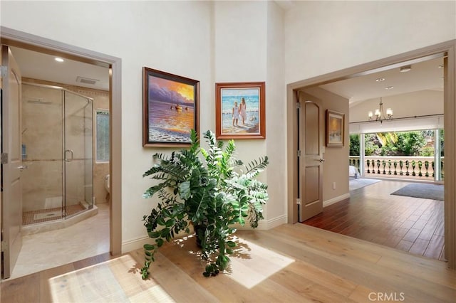 24182 Torena Cir, Mission Viejo, CA 92691 - foyer entrance with baseboards, a chandelier, and wood finished floors