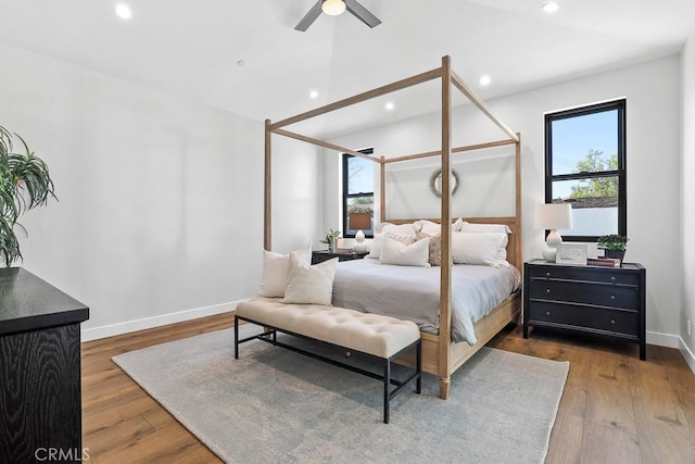 bedroom with wood finished floors, baseboards, recessed lighting, and a ceiling fan