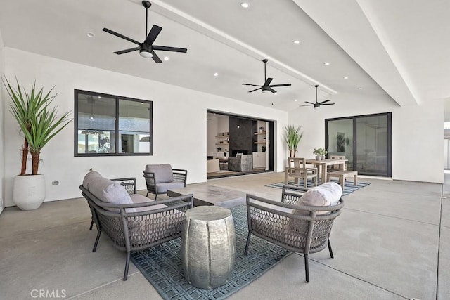 view of patio / terrace with ceiling fan, an outdoor living space, and outdoor dining area