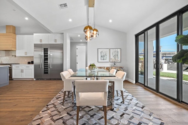 dining room featuring wood finished floors, a chandelier, and recessed lighting