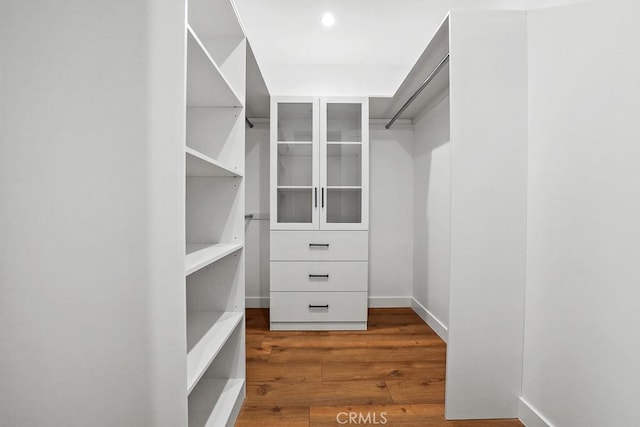 11221 Davenport Rd, Rossmoor, CA 90720 - spacious closet featuring wood finished floors