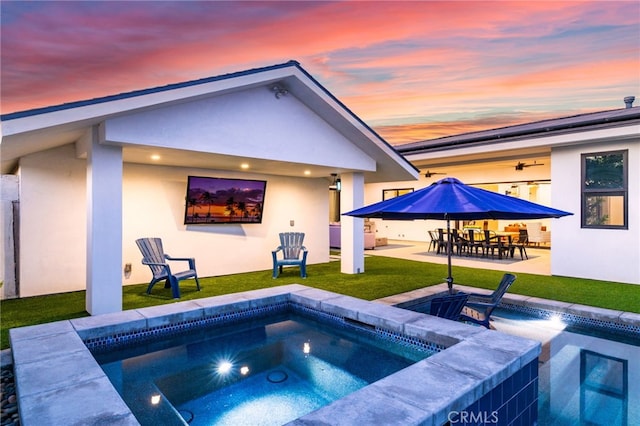 11221 Davenport Rd, Rossmoor, CA 90720 - view of pool featuring an in-ground hot tub, a patio, a lawn, outdoor dining area, and ceiling fan