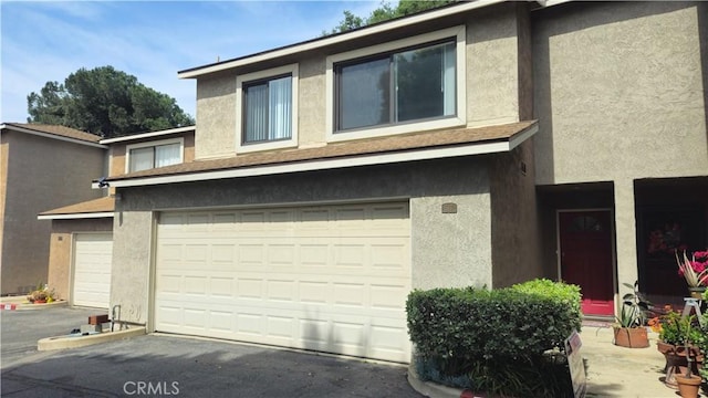 517 Wayland Ct, Claremont, CA 91711 - view of front facade featuring stucco siding and a garage
