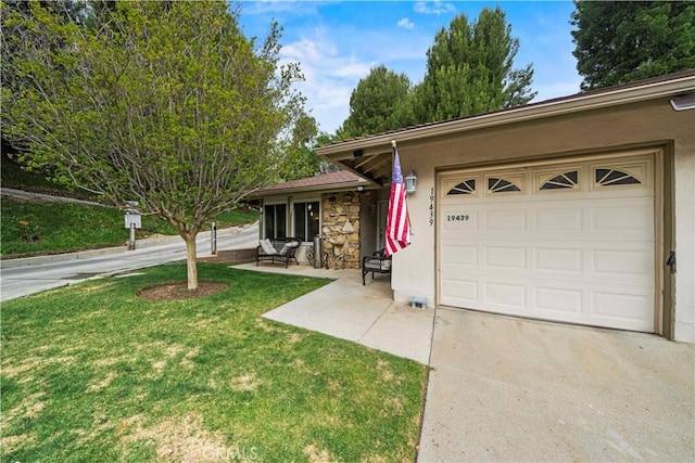 19439 Oak Crossing Rd, Newhall, CA 91321 - ranch-style house with a garage, driveway, a front yard, stone siding, and stucco siding