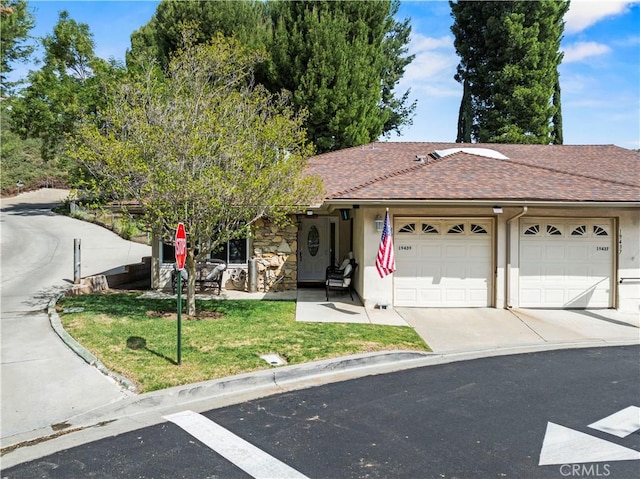 19439 Oak Crossing Rd, Newhall, CA 91321 - view of front facade with an attached garage, a front yard, concrete driveway, and stucco siding