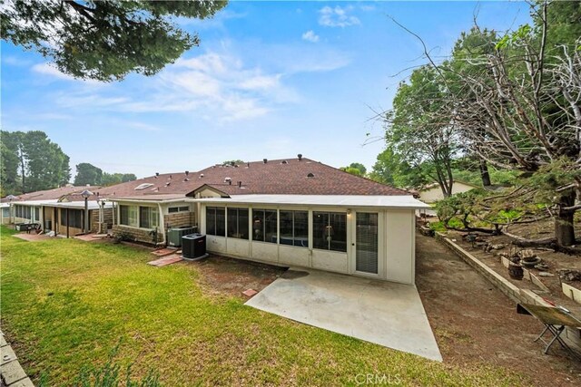 19439 Oak Crossing Rd, Newhall, CA 91321 - rear view of property featuring a patio, a sunroom, and a yard
