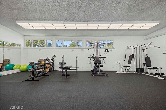 19439 Oak Crossing Rd, Newhall, CA 91321 - exercise room with a textured ceiling
