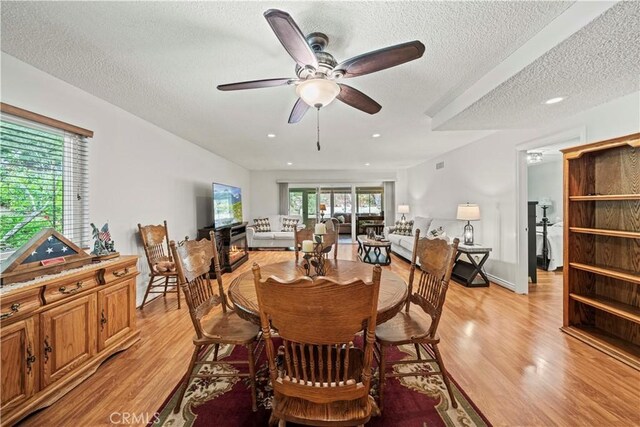 19439 Oak Crossing Rd, Newhall, CA 91321 - dining space featuring a ceiling fan, light wood finished floors, a textured ceiling, and recessed lighting