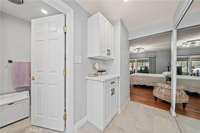 19439 Oak Crossing Rd, Newhall, CA 91321 - bathroom with ensuite bath, tile patterned floors, and recessed lighting